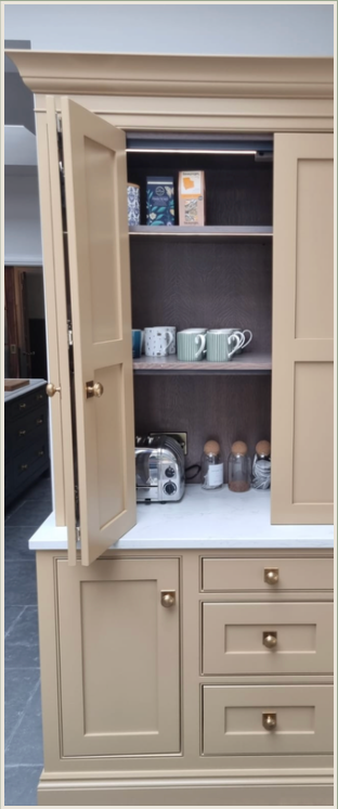 Tan fitted dresser cupboard with brass handles