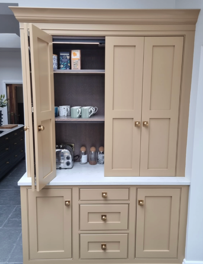 Open bespoke pantry cupboard in warm tan