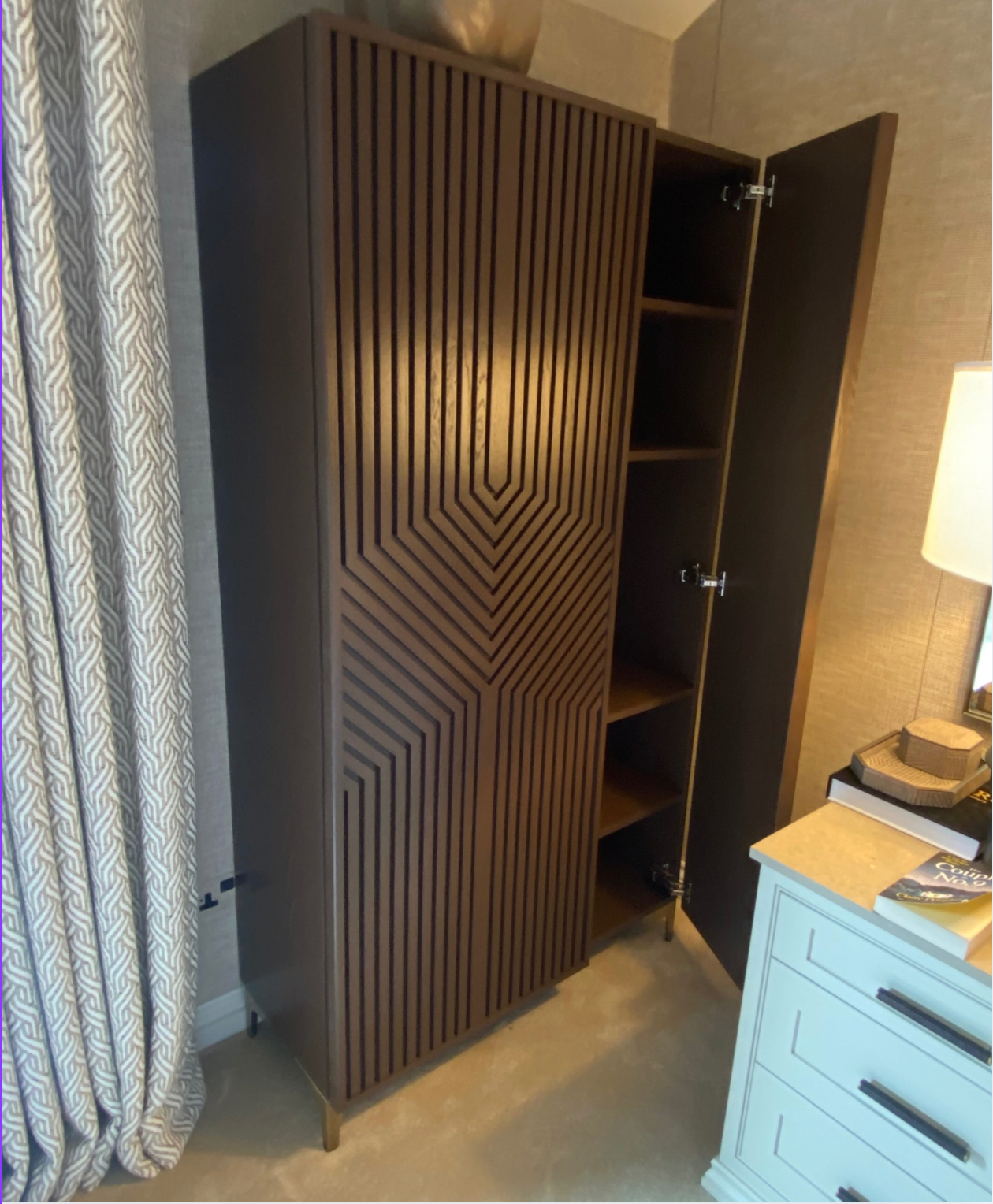 Fluted dark fitted wardrobe with open door